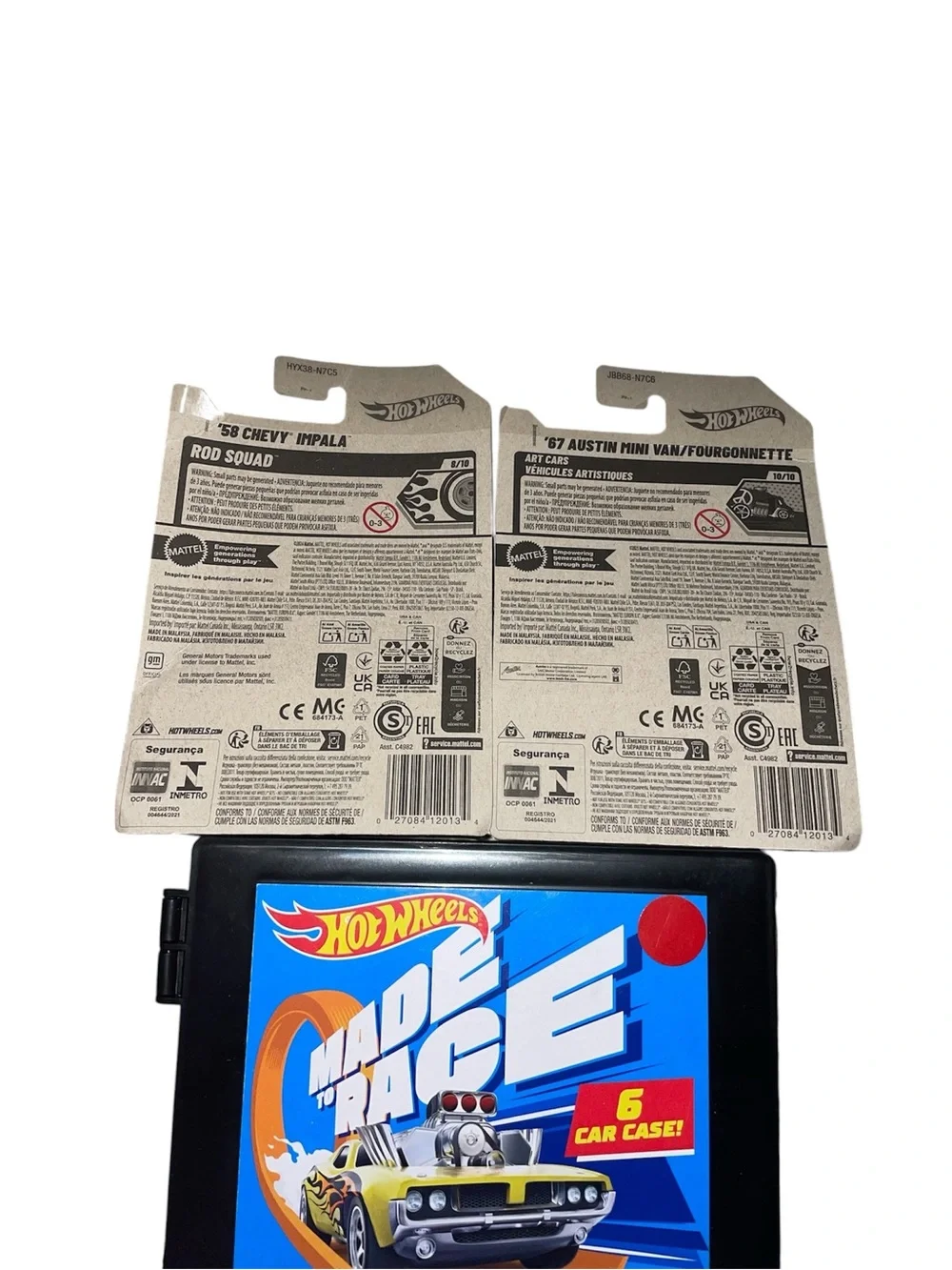 Hot Wheels die-cast cars still sealed in original packaging with 6 car case
